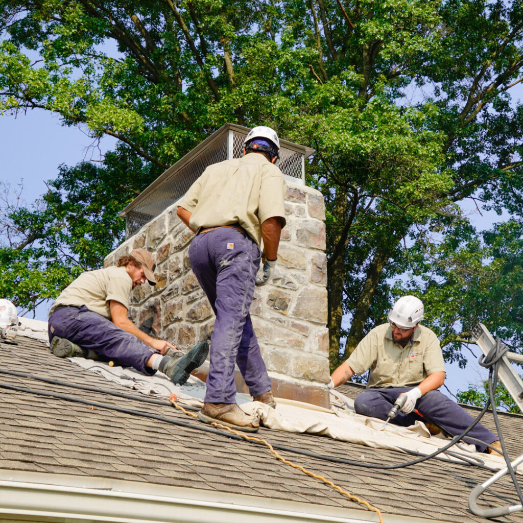 Wells & Sons Techs Repairing Chimney