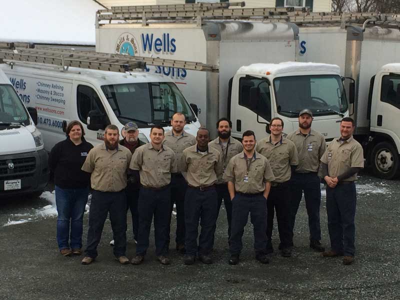 wells and sons crew with service trucks