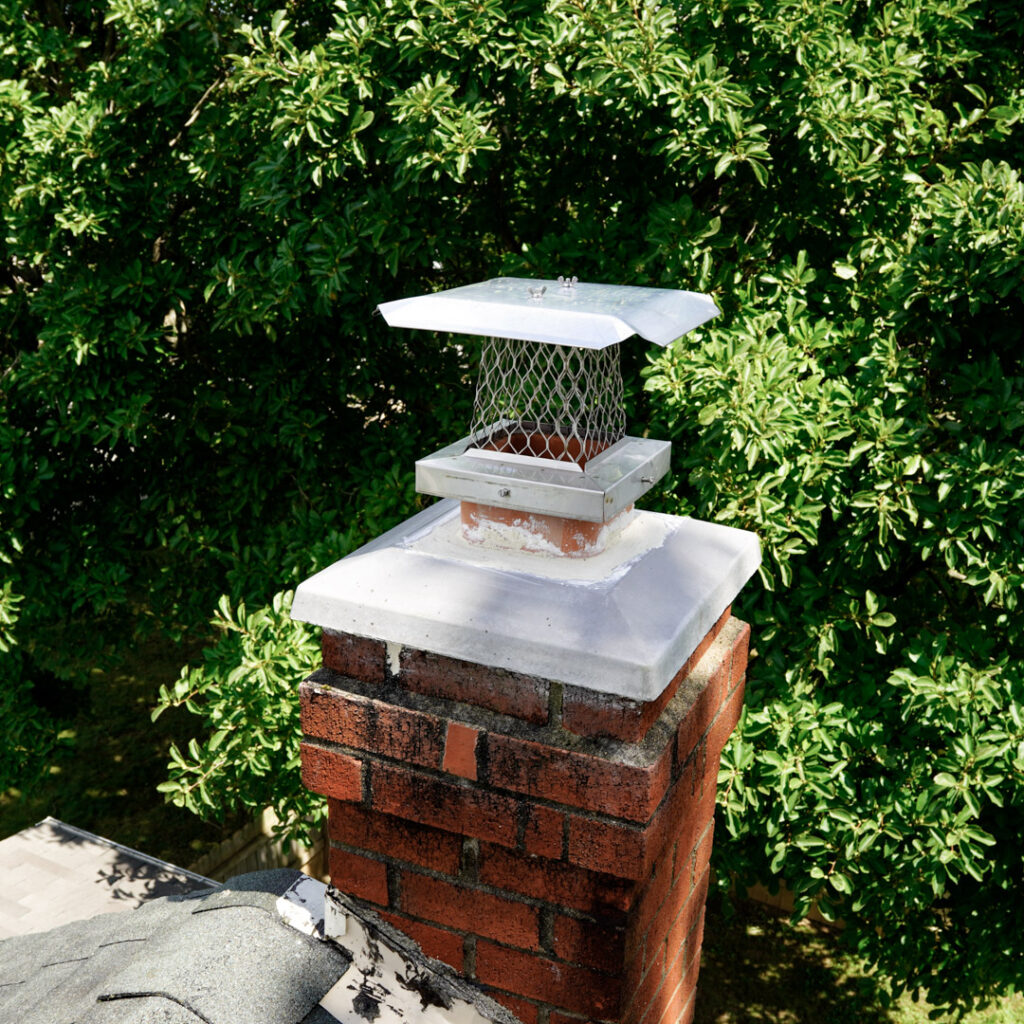 Chimney cap with spark arrestor installation in Malvern, PA.